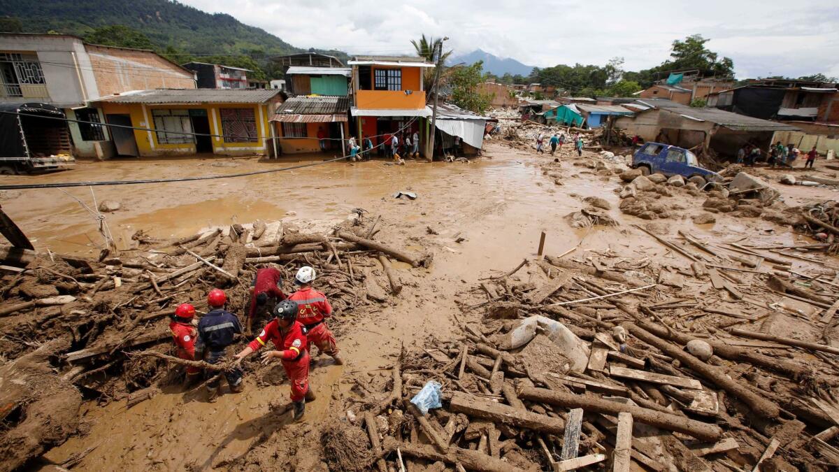Heavy rains sent floodwaters, mud and debris surging through homes in Mocoa, Colombia.