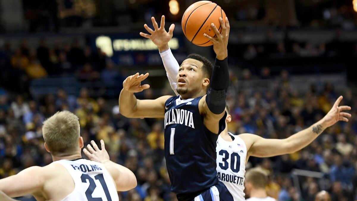 Villanova guard Jalen Brunson drives down the lane for a shot against Marquette during the first half Sunday.