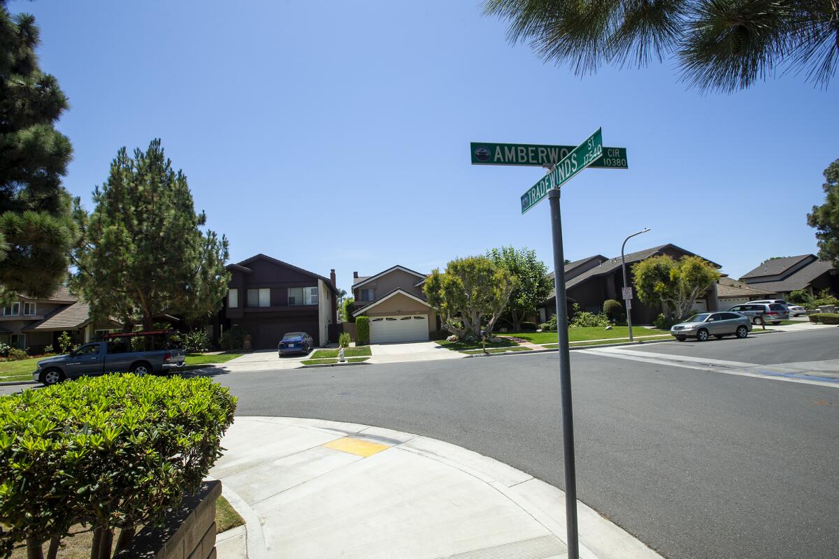 A view from Tradewinds Street toward Amberwood Circle is the scene where a car and body were discovered.  