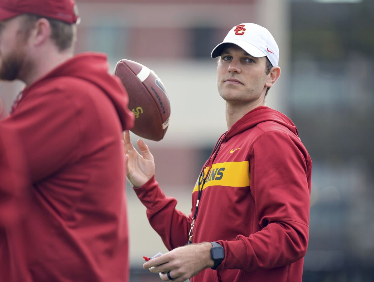 New USC offensive coordinator Graham Harrell watches during spring practice.