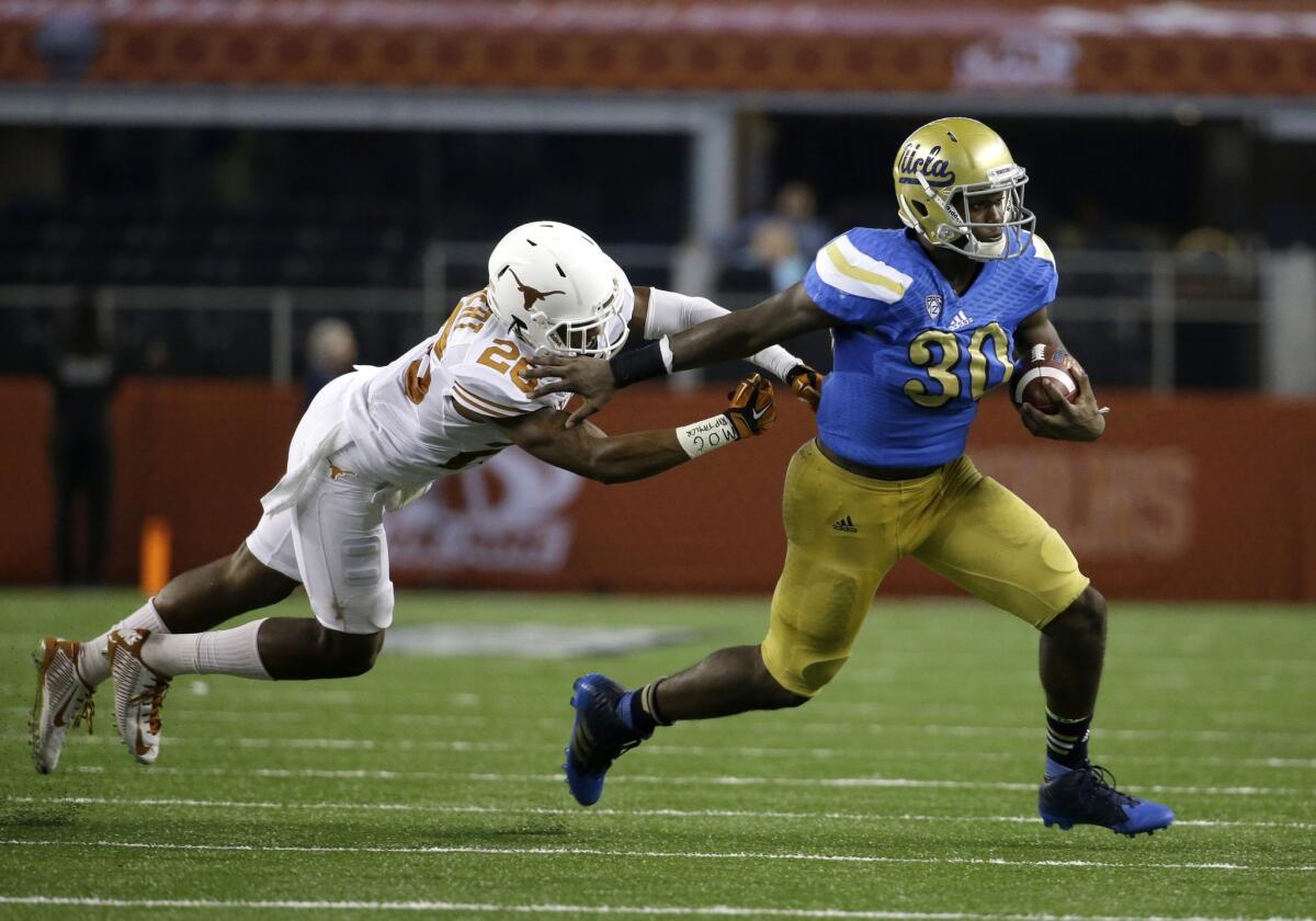 UCLA's Myles Jack breaks past Texas safety Adrian Colbert during the Bruins' 20-17 win over the Longhorns on Sept. 13.