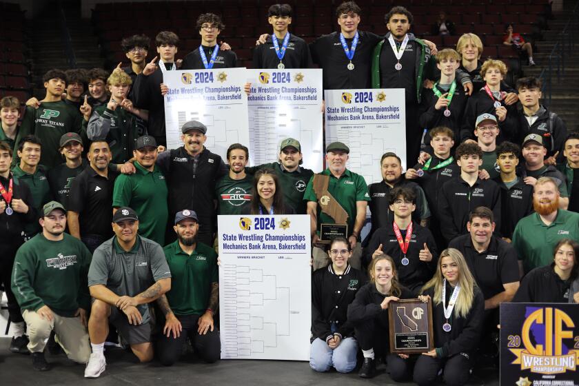 A group shot of the Poway High School boys and girls wrestling teams at the state championships in Bakersfield. 