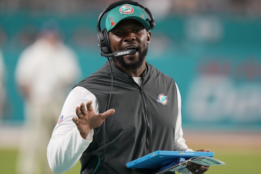 Miami Dolphins head coach Brian Flores directs his team during the second half of an NFL football game against the New England Patriots, Sunday, Jan. 9, 2022, in Miami Gardens, Fla. (AP Photo/Wilfredo Lee)
