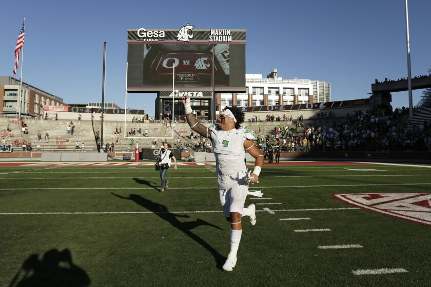 Oregon linebacker Noah Sewell gestures as he leaves the field after his team won an NCAA college football game against Washington State, Saturday, Sept. 24, 2022, in Pullman, Wash. (AP Photo/Young Kwak)