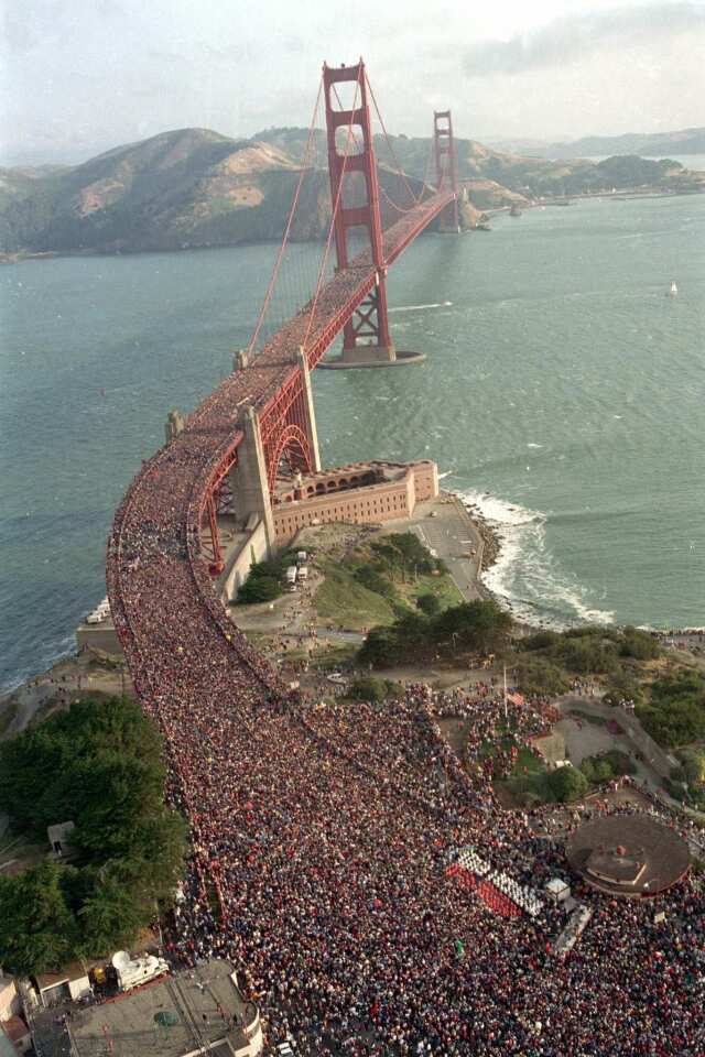 In this May 24, 1987 file photo, a crowd estimated at several hundred thousand jams the deck of the Golden Gate Bridge in San Francisco during a walk to celebrate the 50th anniversary of the bridge.