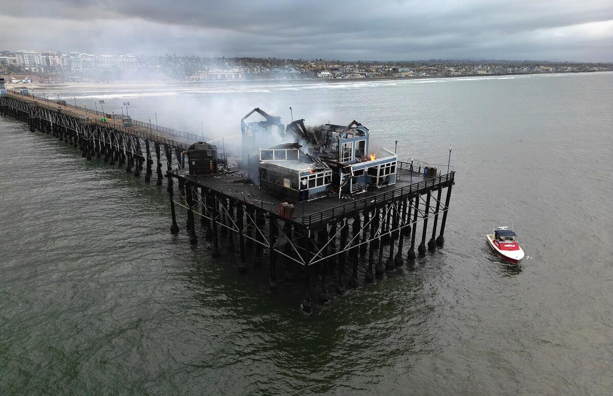 Firefighters knock down main body of fire that charred Oceanside pier ...