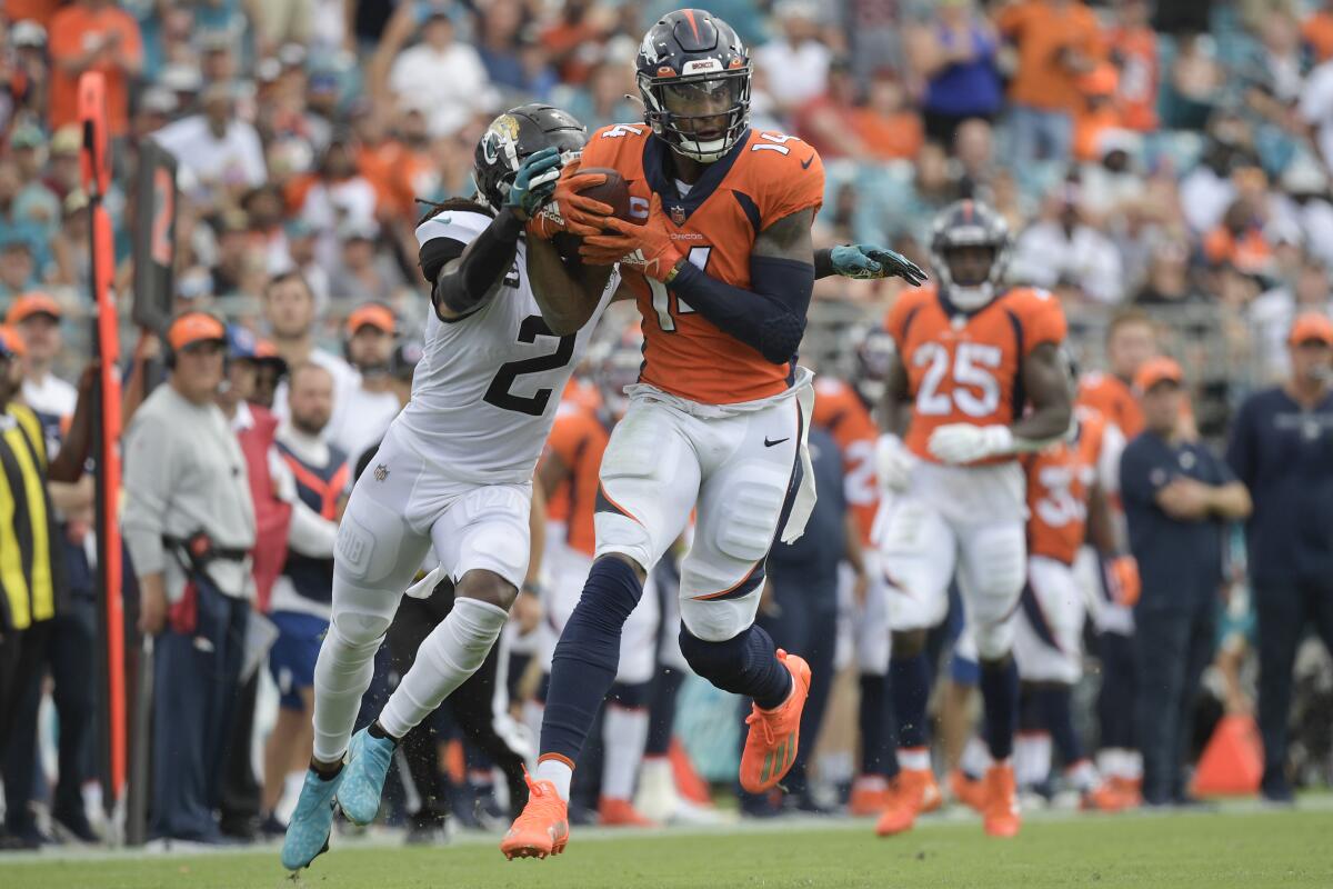 Denver Broncos wide receiver Courtland Sutton catches a pass in front of Jacksonville Jaguars safety Rayshawn Jenkins.