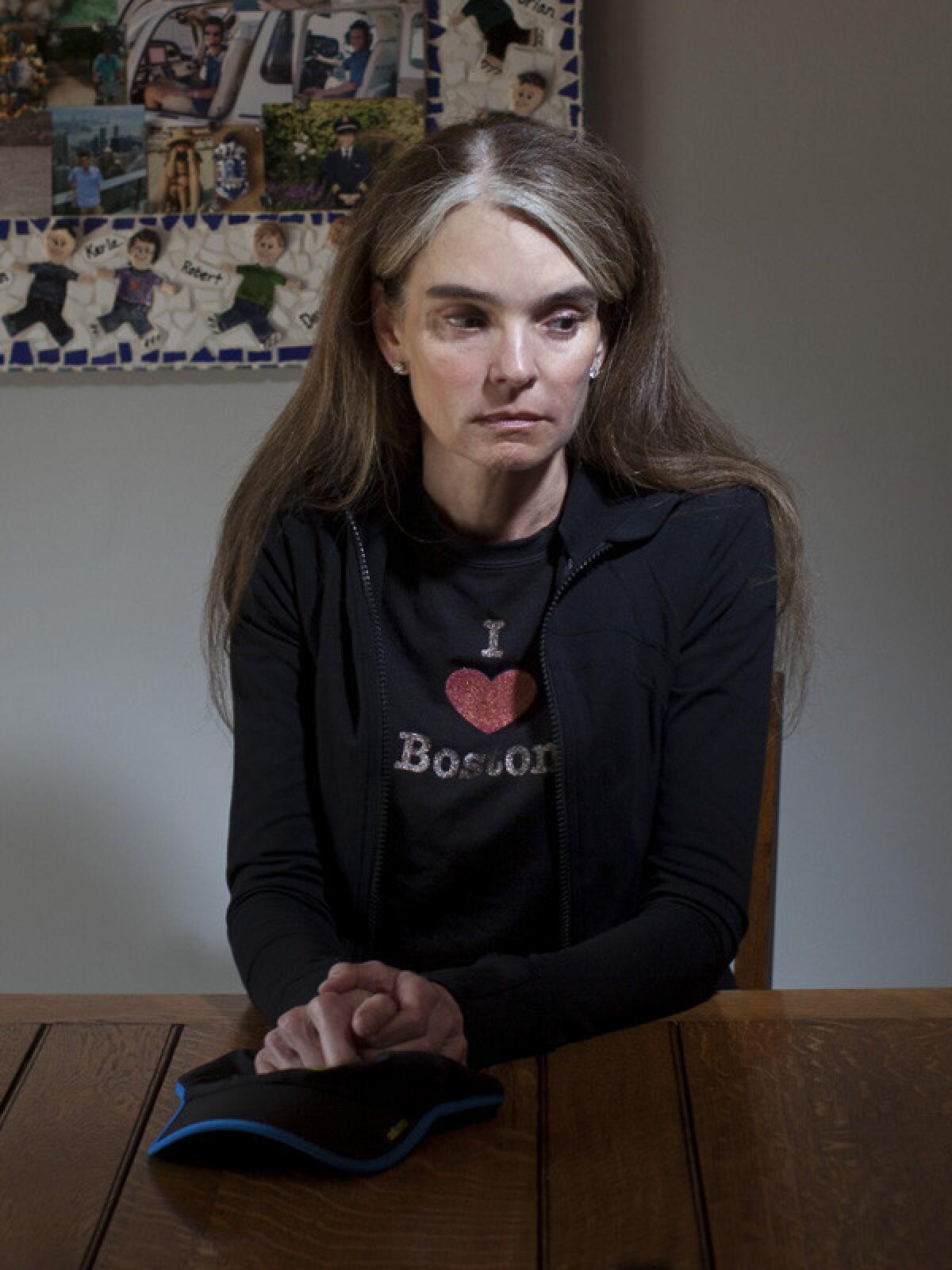 ENCINO, CA -- APRIL 4, 2014--Runner Julie Hardin, who attended the 2013 Boston Marathon and had just completed the race when the bombing occurred, is photographed in her Encino home, April 3, 2014. (Jay L. Clendenin / Los Angeles Times)