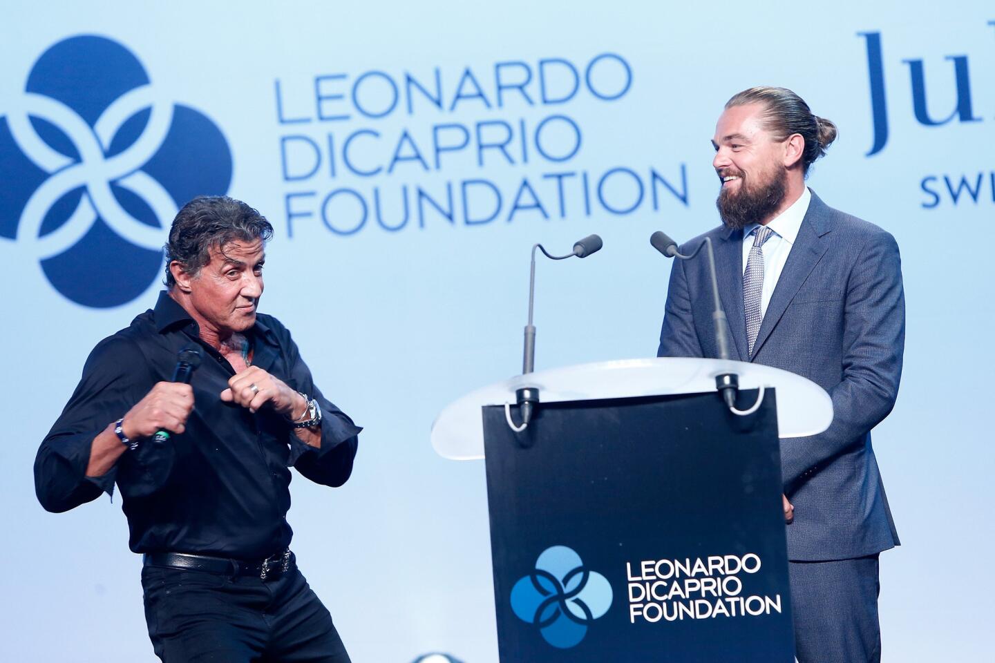 Actors Sylvester Stallone and Leonardo DiCaprio speak onstage during the Leonardo DiCaprio Foundation's gala at Domaine Bertaud Belieu in Saint Tropez, France, on July 22, 2015.