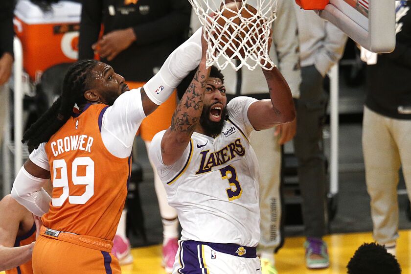 LOS ANGELES, CA - MAY 30: Los Angeles Lakers forward Anthony Davis (3) misses a layup guarded Phoenix Suns.