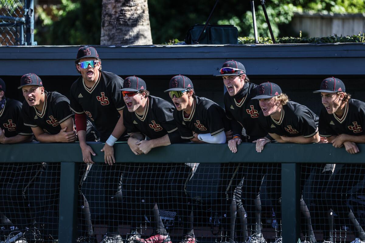 Baseball players shout and cheer