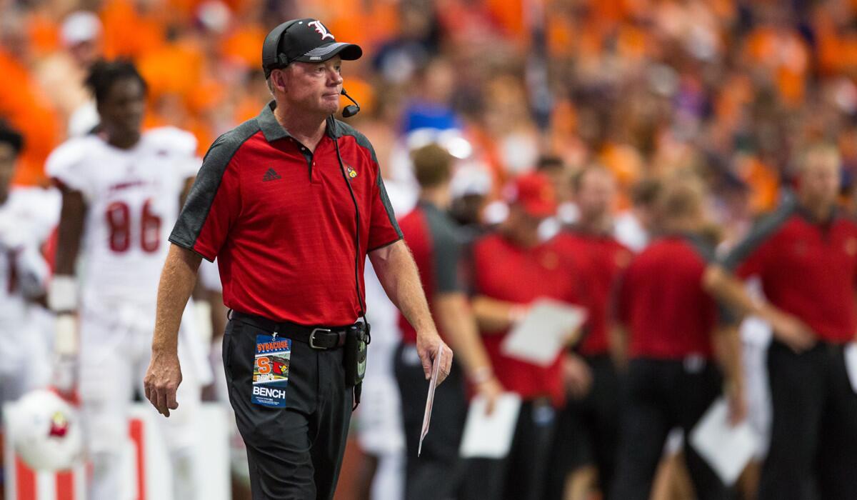 Louisville Coach Bobby Petrino watches on the sidelines on Sept. 9 against Syracuse.
