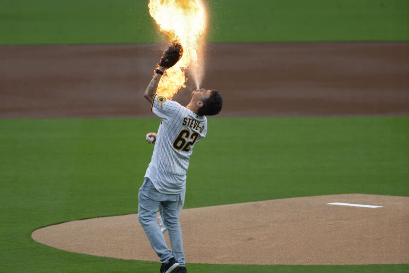 San Diego CA - May 15: Steve-O spits a fireball before throwing out the ceremonial first pitch before the San Diego Padres played the Kansas City Royals at Petco Park on Monday, May 15, 2023. (K.C. Alfred / The San Diego Union-Tribune)s