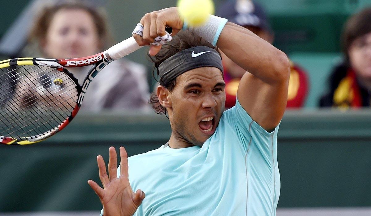 Rafael Nadal returns a shot against David Ferrer in a quarterfinal match at the French Open on Wednesday.