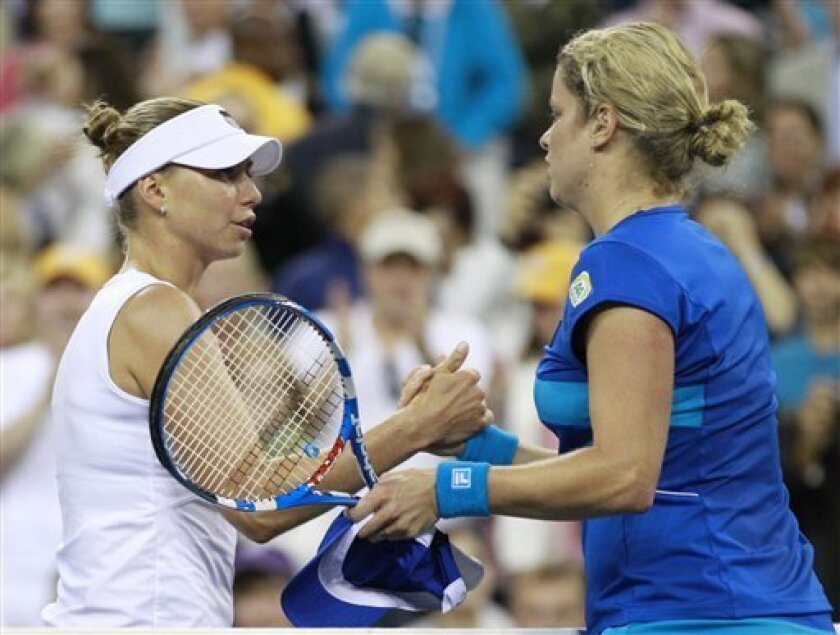 Kim Clijsters, right, of Belgium, is congratulated by Vera Zvonareva, of Russia, after Clijsters won the women's championship match at the U.S. Open tennis tournament in New York, Saturday, Sept. 11, 2010. (AP Photo/Charles Krupa)