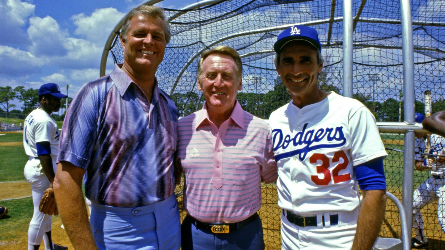 Vin Scully, center, poses for a photo with Dodgers pitching greats Don Drysdale, left, and Sandy Koufax during spring training in Vero Beach, Fla., in 1985.