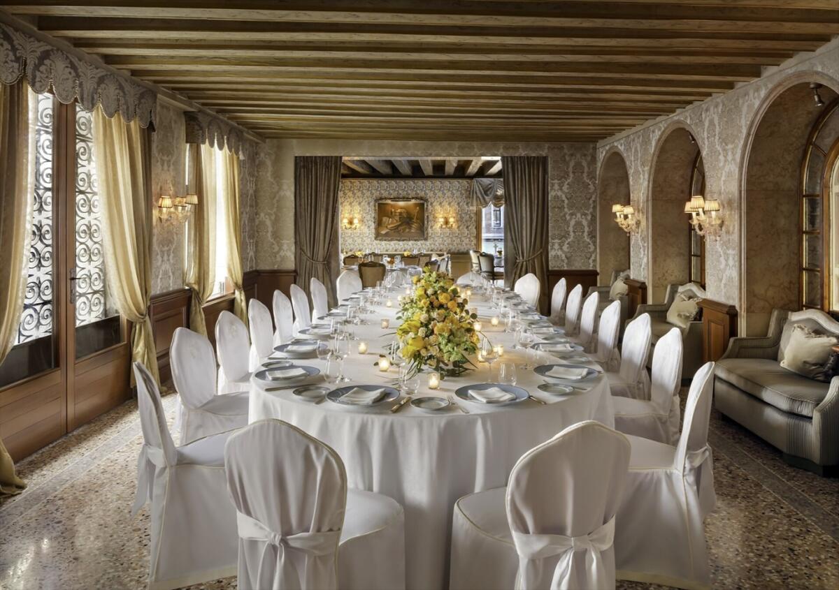 A banquet table set up en suite at Gritti Palace.