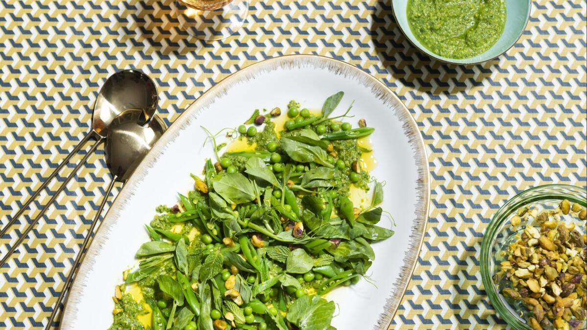 A dish of spring pea salad with pistachios