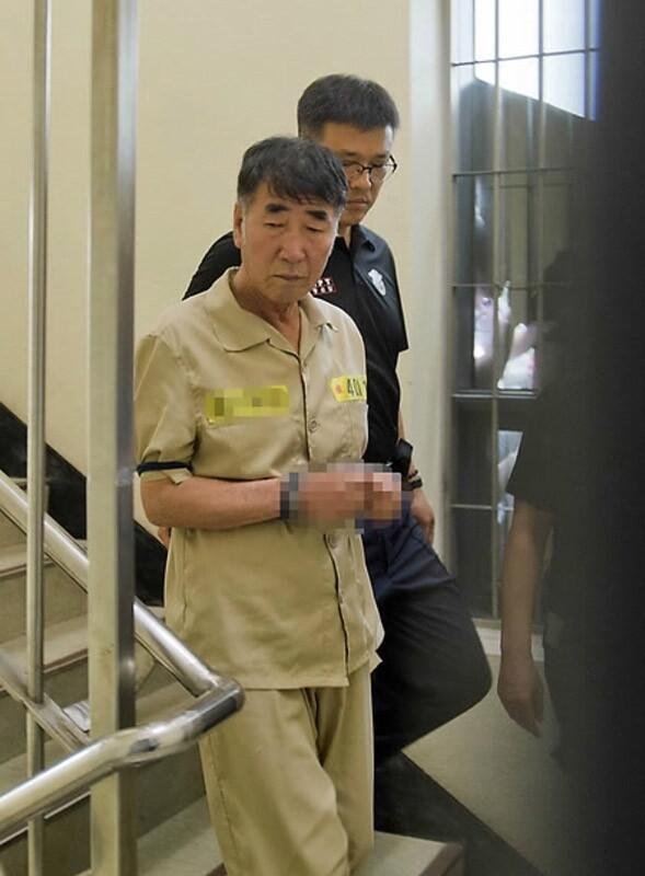 Sewol ferry captain Lee Joon-seok is escorted into court for his trial at the Gwangju District Court in the southwestern South Korean city of Gwangju on June 10.