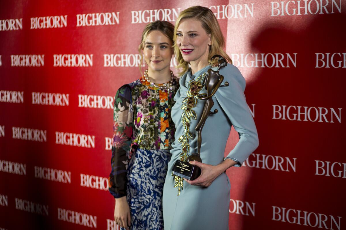 Saoirse Ronan, left, and Cate Blanchett, winner of the Desert Palm Achievement Award, backstage at the 2015 Palm Springs International Film Festival Awards Gala, held at the Palm Springs Convention Center, in Palm Springs on Jan. 2, 2016.