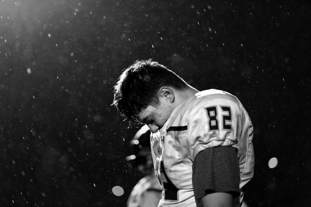 Paradise High School tight end Julian Ontiveros comes to grips with the team's dwindling hopes in the fourth quarter against Sutter.