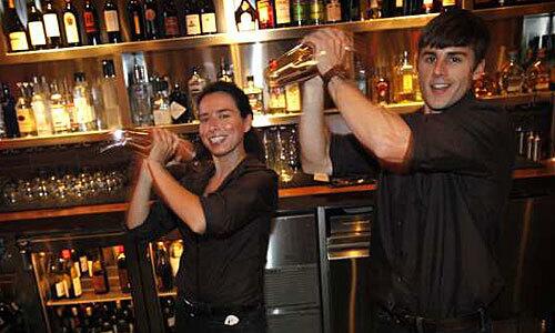 Bartenders Ella Gogel and Kris Kaufman serve up speciality drinks at the Westside Tavern.