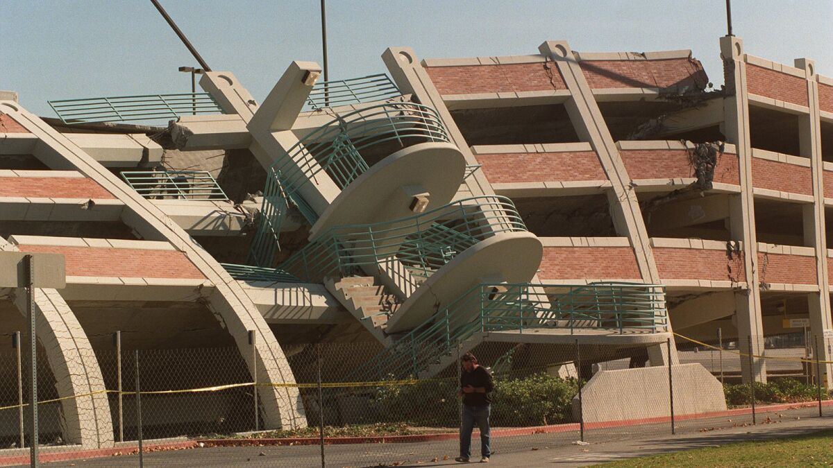 A Cal State Northridge parking structure lies in ruin after the 1994 Northridge quake. Inadequate lateral reinforcing caused total collapse on one side and partial collapse on the other.