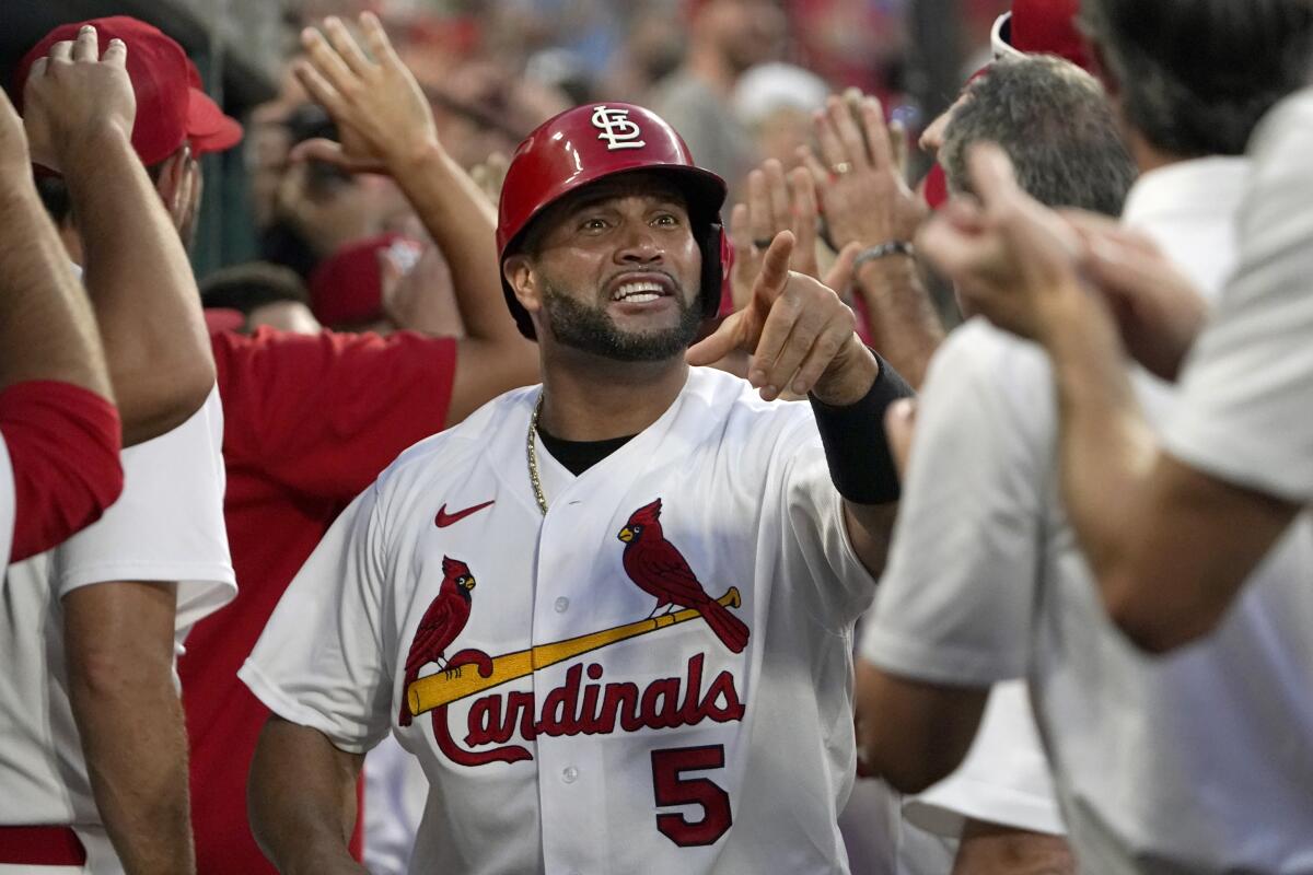St. Louis Cardinals slugger Albert Pujols celebrates after scoring on a two-run home run by Corey Dickerson.