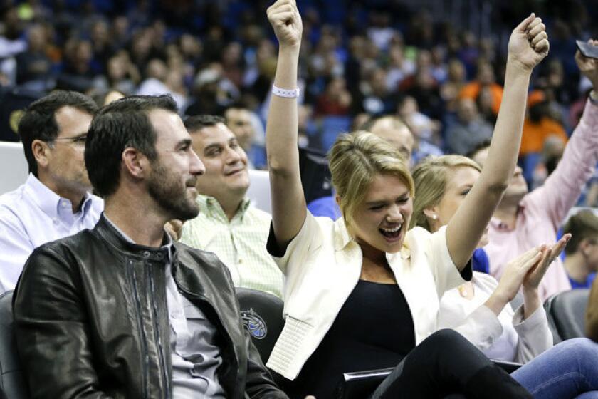 Detroit Tigers pitcher Justin Verlander and model Kate Upton take in the Thunder-Magic game on Friday night in Orlando.