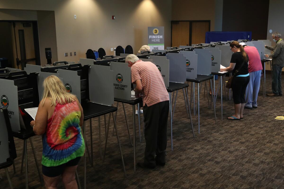 Voters cast their ballots at Huntington Beach Central Library.