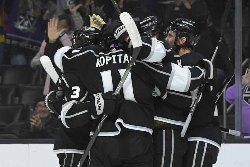 The Los Angeles Kings celebrate after right wing Adrian Kempe scored a goal against the New Jersey Devils.
