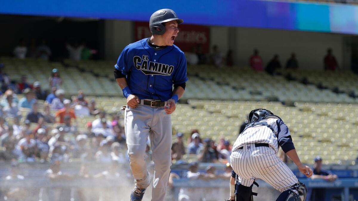 El Camino Real's Eric Yang celebrates as he scores in the sixth inning for a 2-1 lead over Chatsworth in the City Section Division I championship game on Saturday at Dodger Stadium.