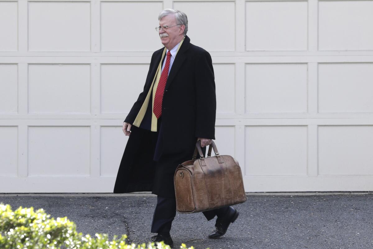 Former national security advisor John Bolton leaves his home in Bethesda, Md., on Jan. 28 while President Trump's impeachment trial was underway.