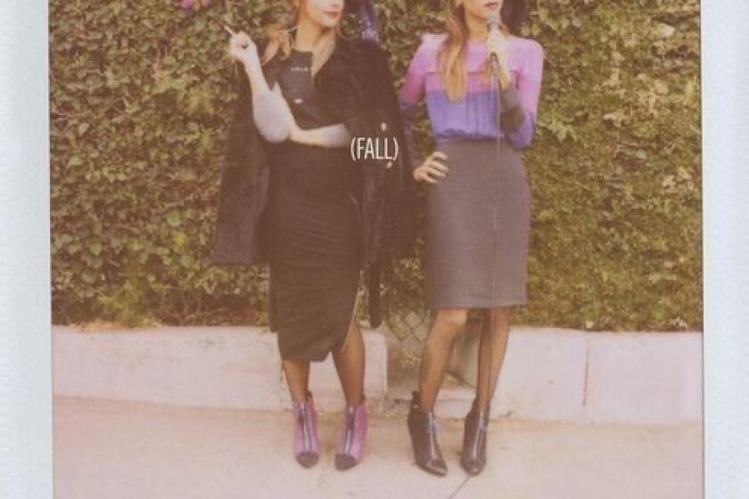 The Band of Outsiders fall 2013 women's ad campaign, featuring sisters Rashida, left, and Kidada Jones was shot using a Polaroid camera at the Dresden Restaurant in Los Angeles.
