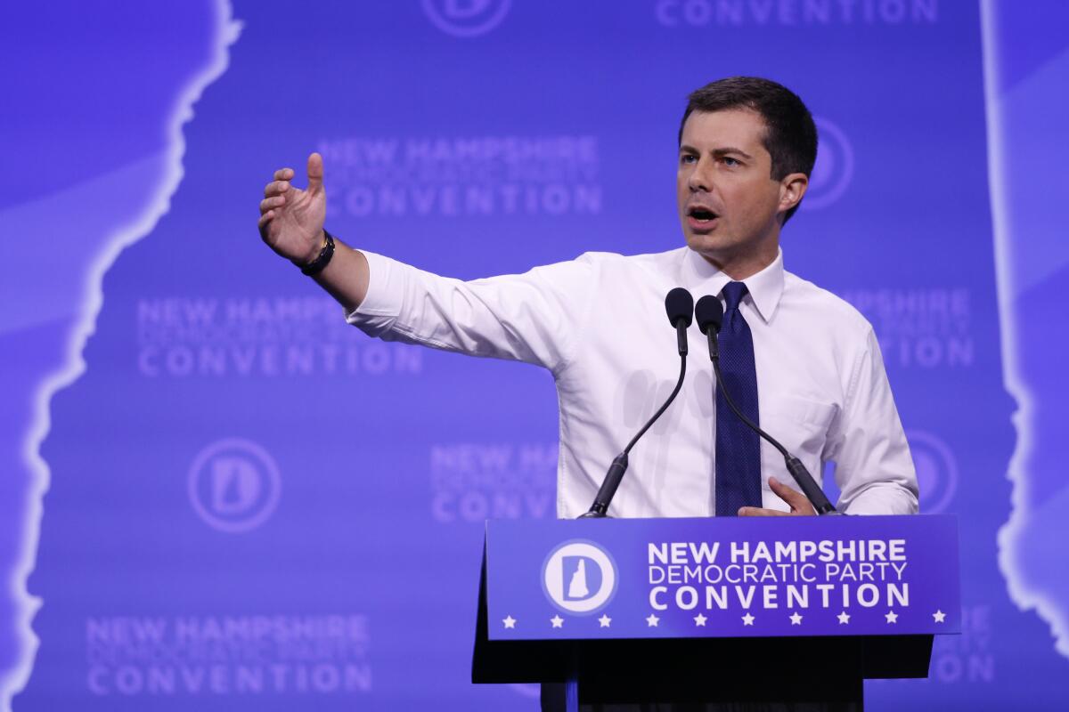 Pete Buttigieg speaks at a lectern during the New Hampshire Democratic Party Convention.