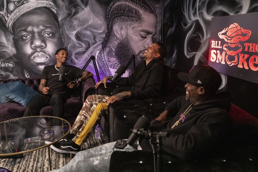 Clippers guard Lou Williams, left, speaks with former NBA players Matt Barnes, center, and Stephen Jackson on Showtime's "All the Smoke" video podcast.