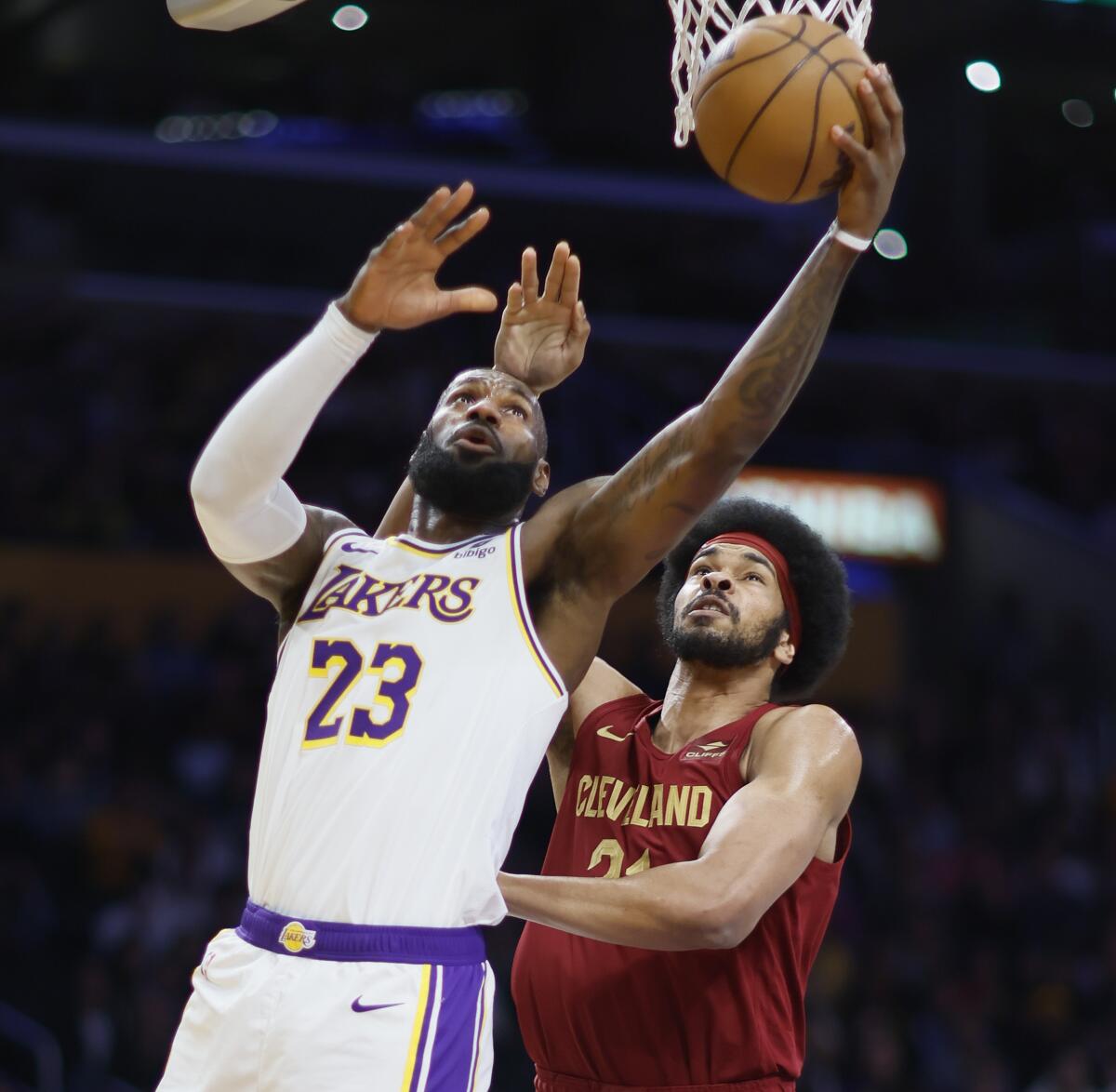 Lakers star LeBron James shoots in front of Cleveland center Jarrett Allen.