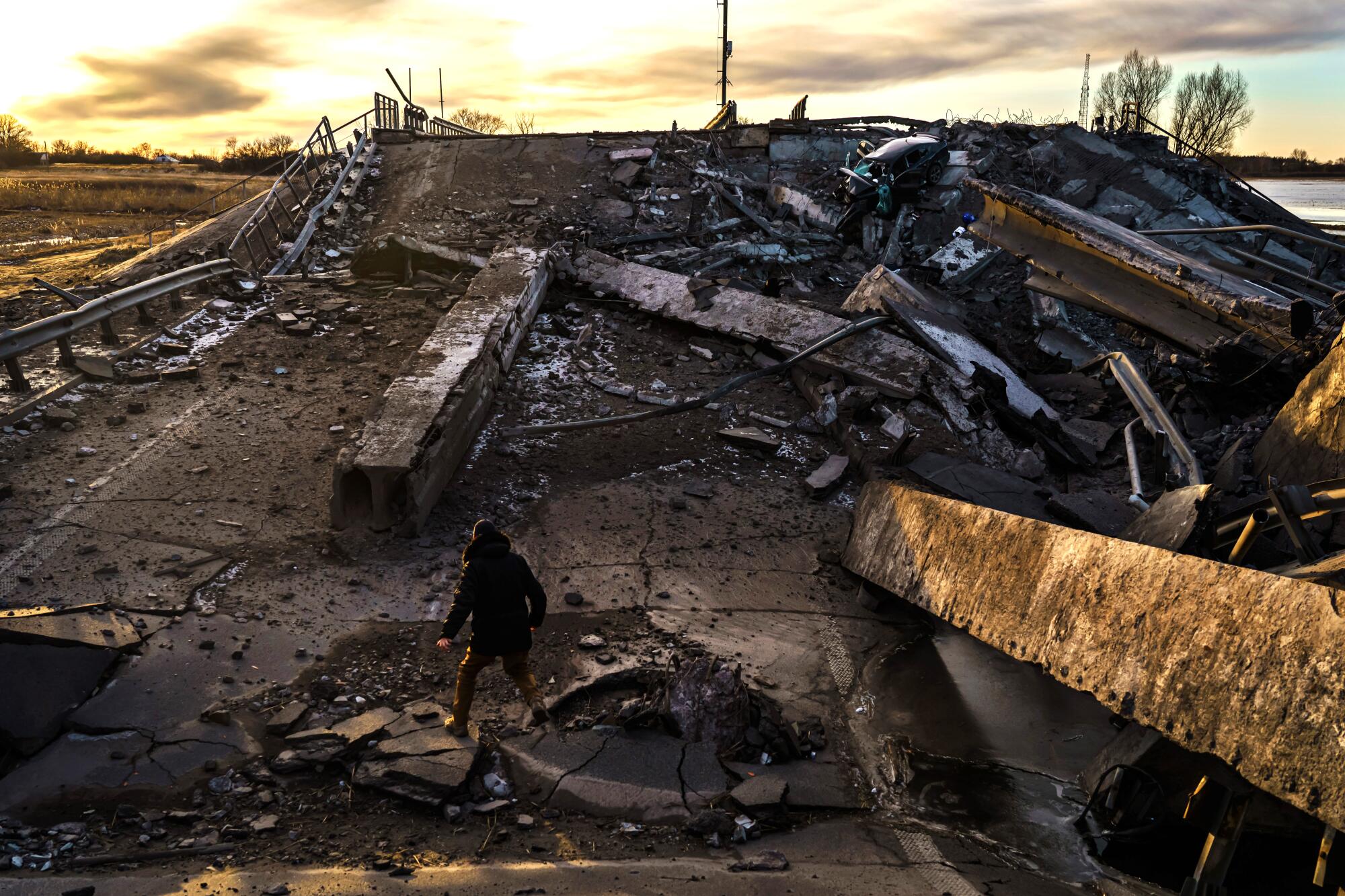 A bridge that crossed the Trubizh River is destroyed on a road leading to Borshchiv, Ukraine.