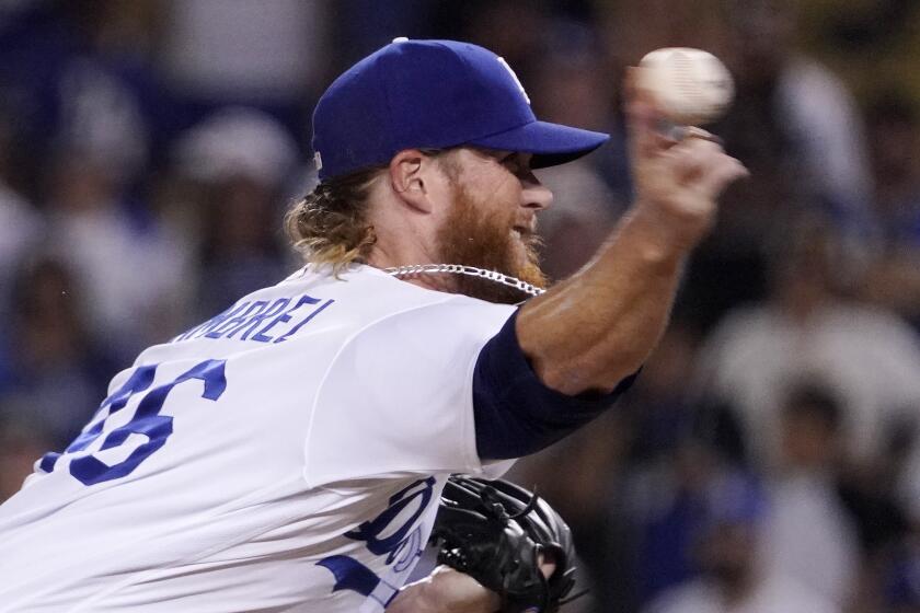 Los Angeles Dodgers relief pitcher Craig Kimbrel throws to the plate during the ninth inning.