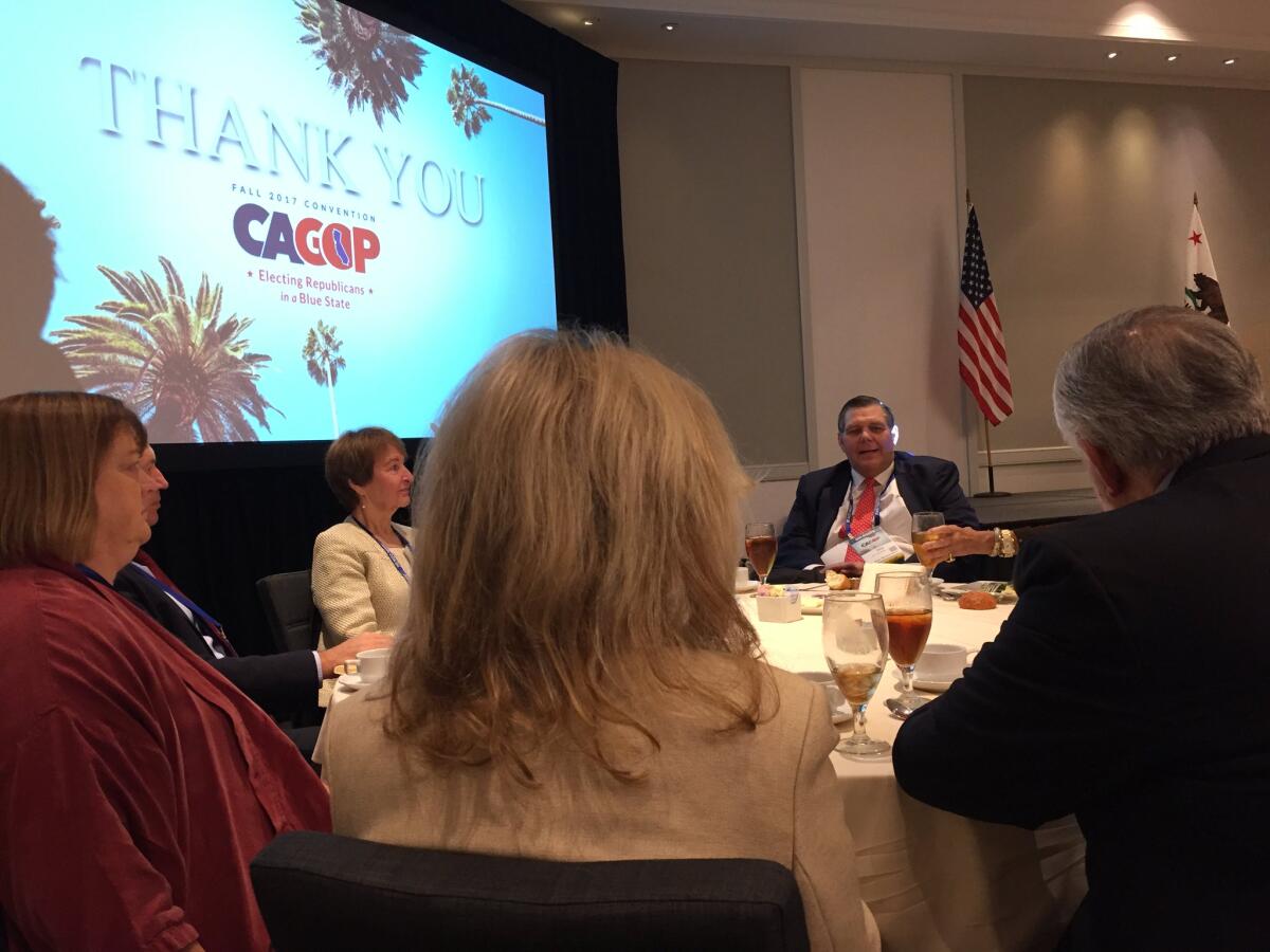 California Republican Party Chairman Jim Brulte, center, addresses GOP delegates at the state party's convention in Anaheim on Friday.