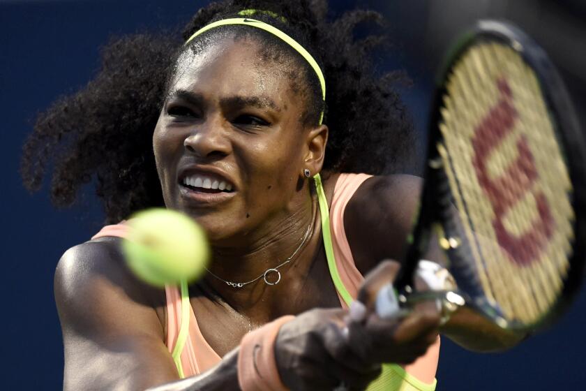 Serena Williams returns a shot against Roberta Vinci during a quarterfinal match at the Rogers Cup in Toronto.