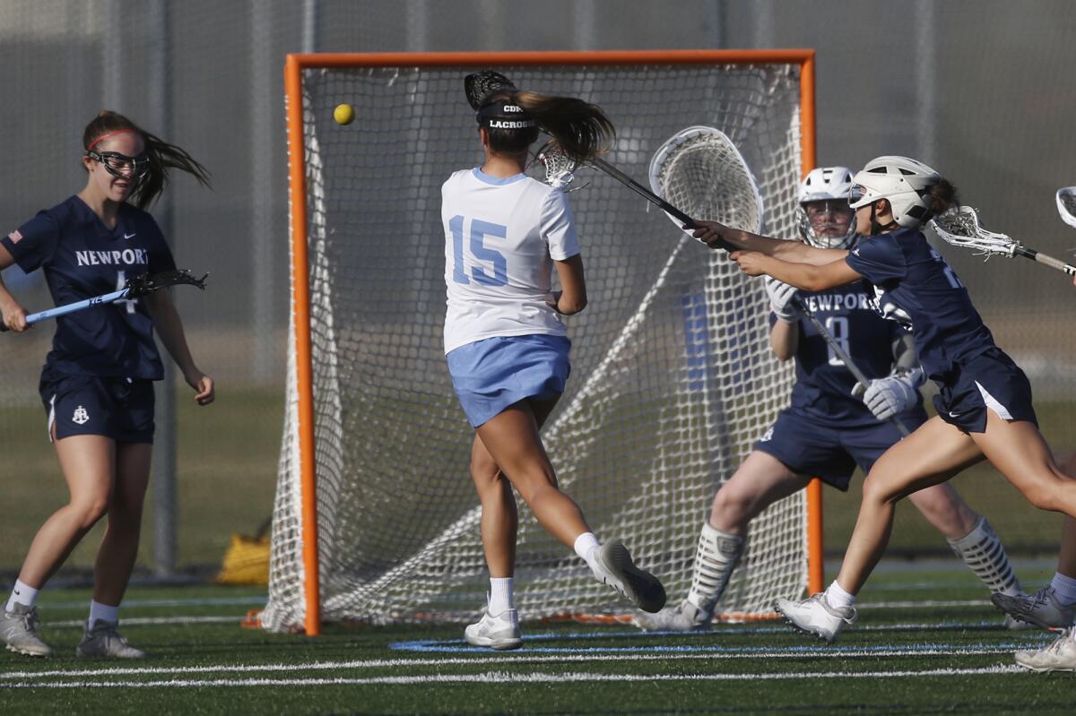 Corona Del Mar's Frankie Garcia (15) shoots and scores during Thursday's match.