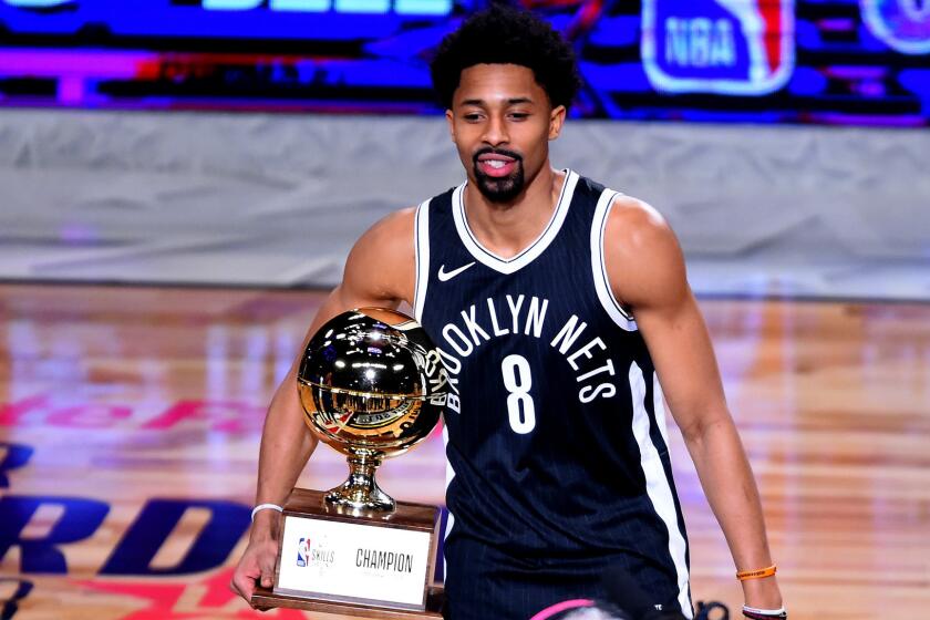 Spencer Dinwiddie poses with the Skills Challenge Trophy after winning the competition on Saturday night at Staples Center.