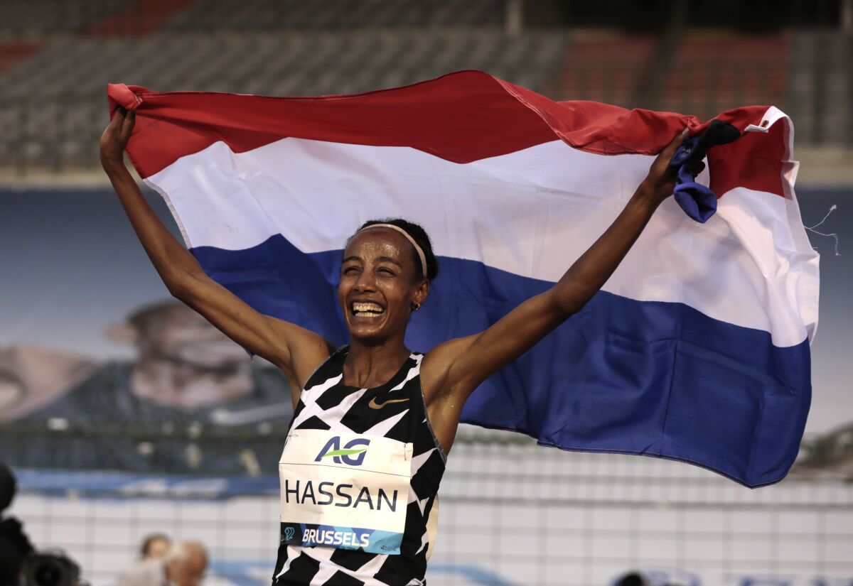 Netherland's Sifan Hassan jubilates after setting a new world record during the One Hour Women at the Diamond League Memorial Van Damme athletics event at the King Baudouin stadium in Brussels on Friday, Sept. 4, 2020. (AP Photo/Virginia Mayo)