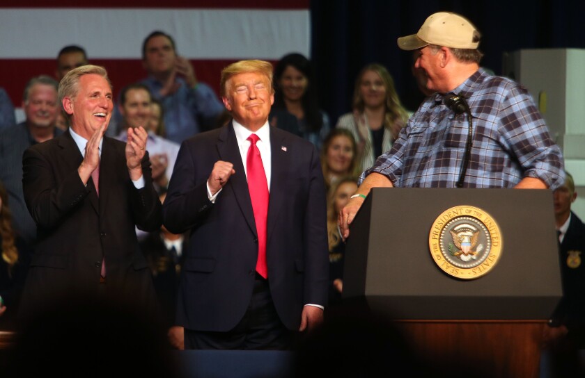 House Republican leader Kevin McCarthy, President Trump and farmer Larry Starrh during a 2020 visit to Bakersfield. 