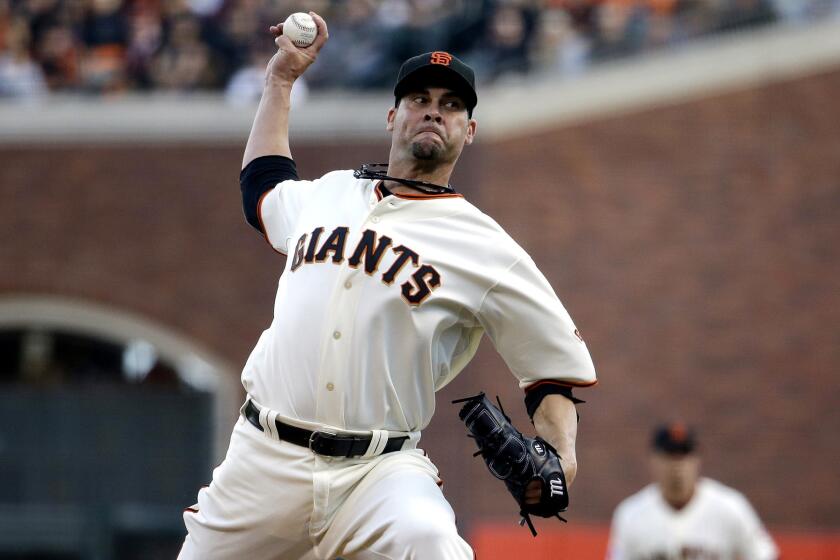 Giants starter Ryan Vogelsong delivers a pitch against the St. Louis Cardinals in Game 4 of the National League Championship Series.