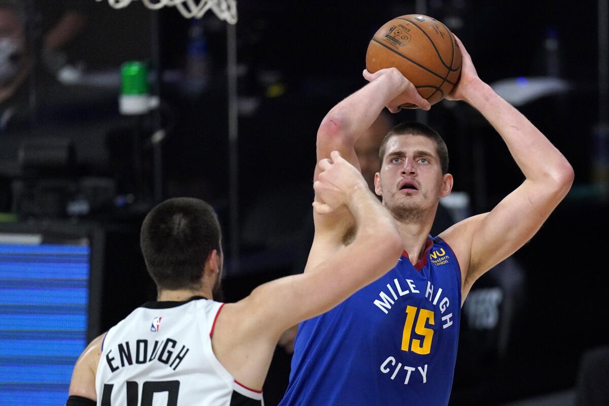 Nuggets center Nikola Jokic shoots over the Clippers' Ivica Zubac.