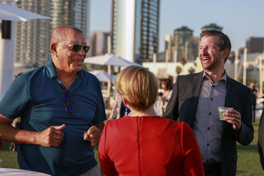 Left, Bertrand Derome, managing Director of the World Design Organization, spshares a laugh with Dr. Randy Ward during a showcase party at The Rady Shell in Downtown San Diego on Sunday, October 3, 2021. San Diego and Tijuana have filed a joint bid to become a "World Design Capital". A winner is selected every two years by the World Design Organization.(Photo by Sandy Huffaker for The San Diego Union-Tribune)