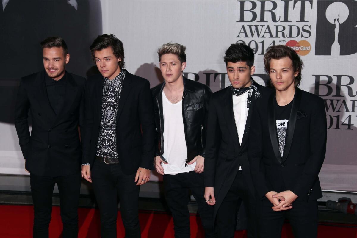 British band One Direction -- from left, Liam Payne, Harry Styles, Niall Horan, Zayn Malik and Louis Tomlinson -- arrive at the Brit Awards 2014 in London.