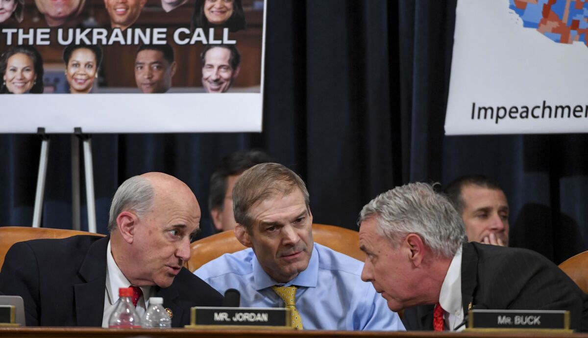 Republican Reps. Louie Gohmert of Texas, left, Jim Jordan of Ohio and Ken Buck of Colorado confer during the House Judiciary Committee debate on Thursday.